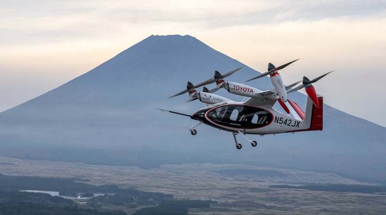 A Joby production prototype electric air taxi flying in front of Mount Fuji in Shizuoka, Japan. Joby Aviation photo