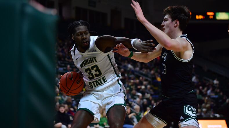 Wright State's Michael Imariagbe (left) looks to score inside vs. Green Bay at the Nutter Center on Jan. 2, 2025. Joe Craven/Wright STate Athletics photo