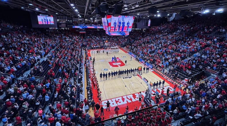 Dayton and George Washington stand for the national anthem on Tuesday, Jan. 6, 2026, at UD Arena. David Jablonski/Staff