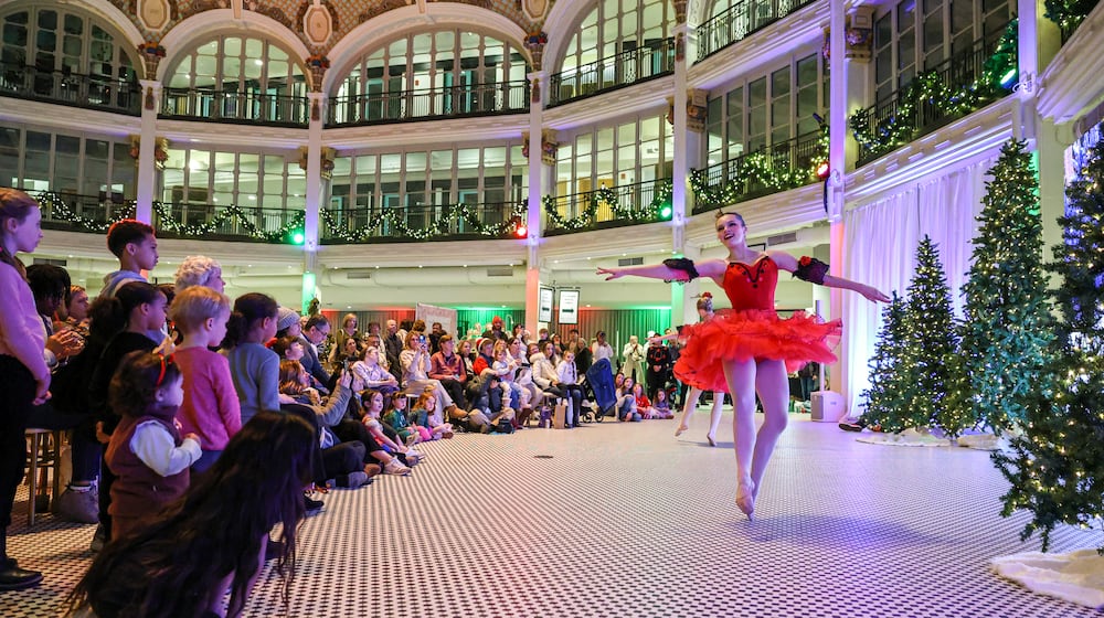Miami Valley Dance Company dancers perform during Holly Days at Dayton Arcade on Thursday, Dec. 11. BRYANT BILLING/STAFF