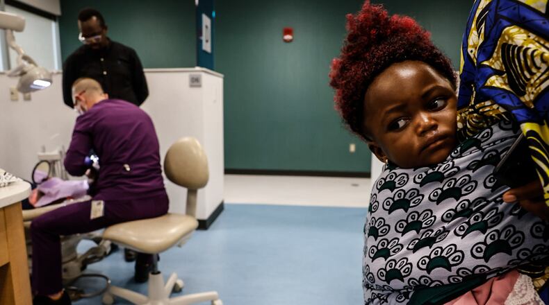 Refugee children from the Congo are provided dental care by Sinclair Community College dental hygiene students at the Sinclair Community College Midmark Dental Health Clinic on Monday, June 3, 2024. JIM NOELKER/STAFF