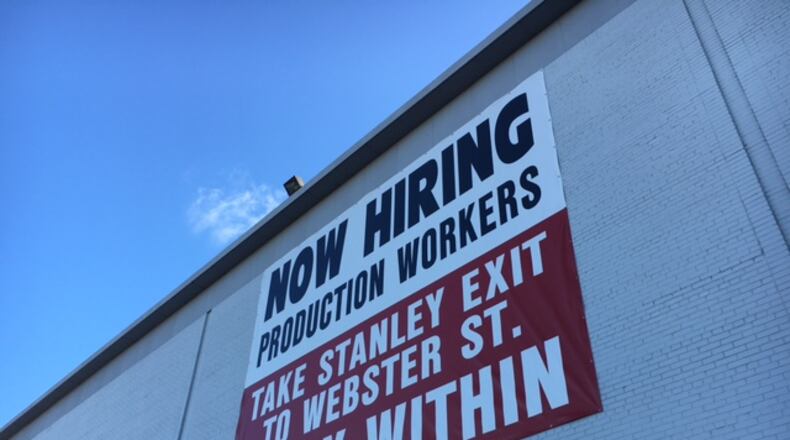 A sign at the Mahle Behr plant in Dayton, facing Webster Street, has for years invited job applicants to inquire within. THOMAS GNAU/STAFF