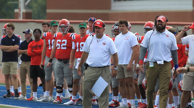 Dayton's Mark Ewald, center, coaches during a game against Eastern Illinois on Saturday, Sept. 11, 2021, at Welcome Stadium. David Jablonski/Staff