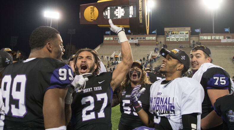Mount Union’s Gabe Brown(27) celebrates with his teammates after defeating Mary Hardin-Baylor during the second half of the Amos Alonzo Stagg Bowl NCAA Division III college football championship Friday, Dec.15, 2017, in Salem,Va. (AP Photo/Lee Luther Jr.)