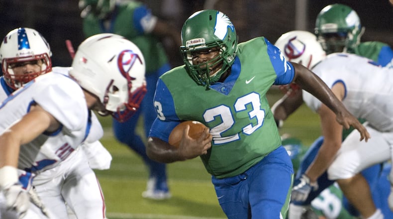 Chaminade Julienne running back Marquis Henry gains big yardage in the first half Friday night at Carroll. Jeff Gilbert/CONTRIBUTED
