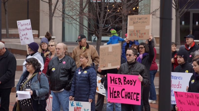 Pro-Planned Parenthood protesters gather in downtown Dayton in February. JORDYN HUFFMAN / STAFF