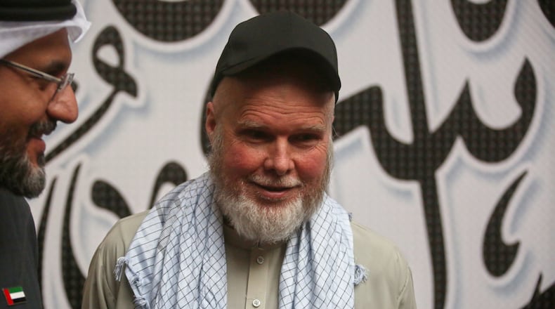 American Dennis Coyle smiles after being released by Afghanistan's Taliban authorities, who had held him for over a year, before boarding a plane at the airport in Kabul, Afghanistan, Tuesday, March 24, 2026. (AP Photo/Mudassir Safi)