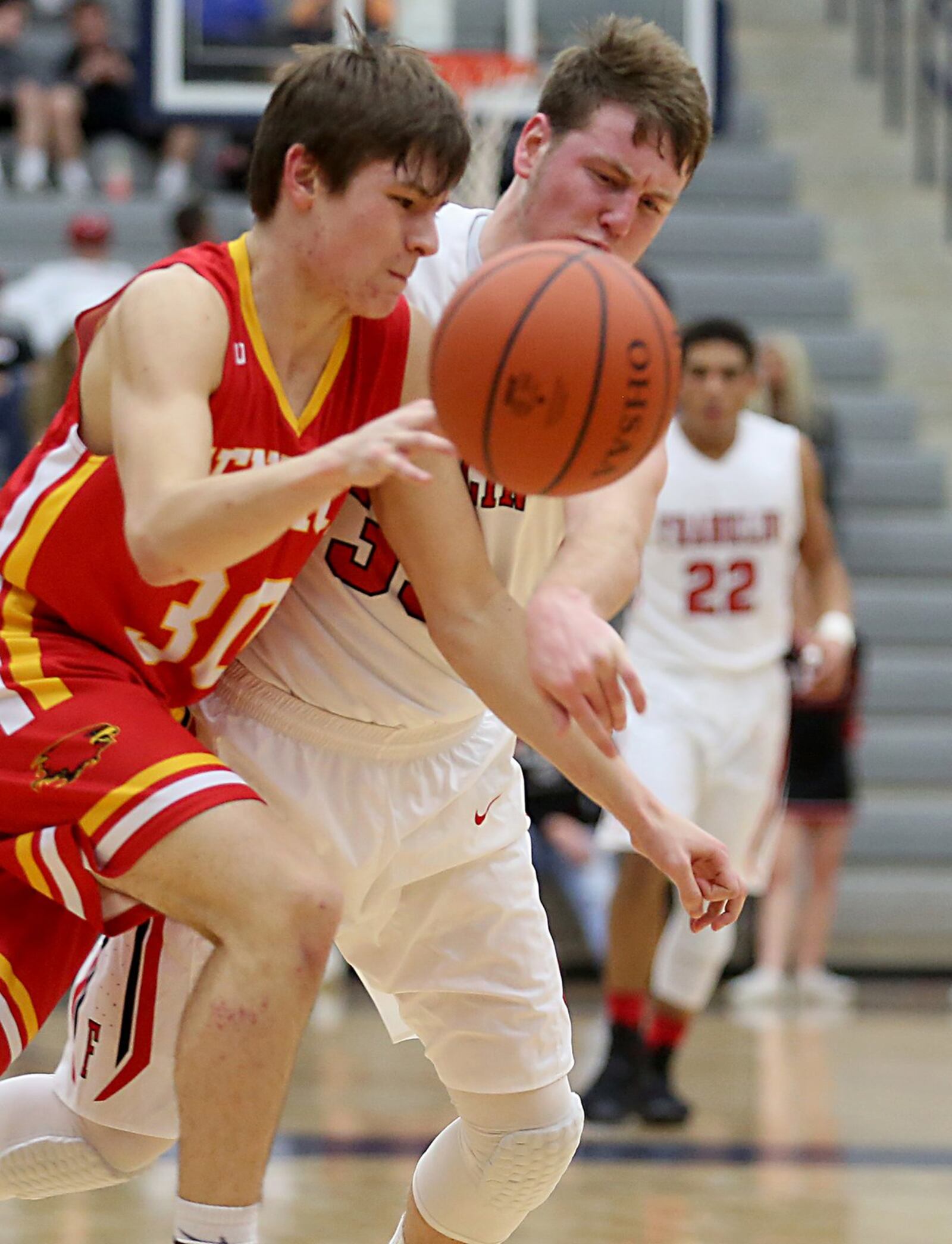 Franklin’s Konner Black tries to swat the ball away from Fenwick’s John Engelmeier during Saturday’s Division II sectional game at Fairmont’s Trent Arena. CONTRIBUTED PHOTO BY E.L. HUBBARD