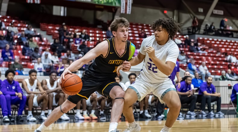 Centerville High School junior Sam Keely drives past Pickerington Central's Christian Coleman during their game on Thursday, March 12, 2026 at the Ohio Expo Center's Taft Coliseum. MICHAEL COOPER / STAFF