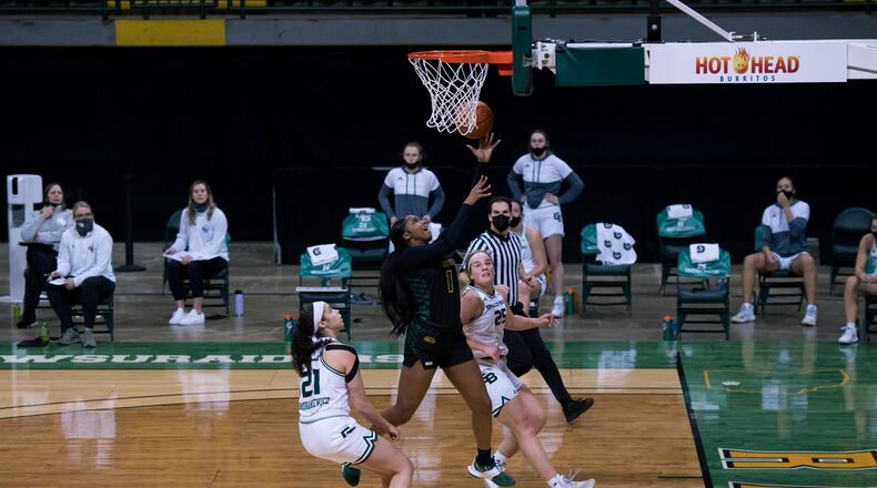 Wright State's Alexis Stover goes up for a bucket in between Green Bay's Lyndsey Robson (25) and Jasmine Kondrakiewiz during a game on Feb. 20, 2021, at the Nutter Center. Joseph Craven/WSU Athletics