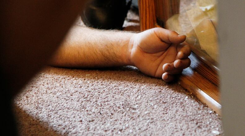 Dayton Police Department Officer Joe Sheen was first to arrive and administer naloxone to a man suffering an opioid overdose in 2016. It took Sheen and Dayton Fire Department medics 12 doses of naloxone to revive the man. CHRIS STEWART / STAFF