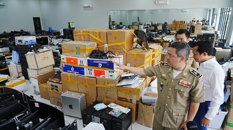 FILE - Bun Sosekha, Deputy Commissioner in charge of Security Unit, Phnom Penh Municipal Police, gives a tour of a scam center to journalists in Phnom Penh, Cambodia, Wednesday, March 11, 2026. (AP Photo/Heng Sinith, file)