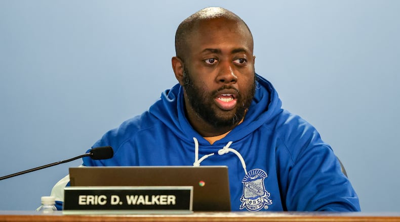 Dayton Public Schools board member Eric Walker talks during an emergency board meeting in April. BRYANT BILLING / STAFF