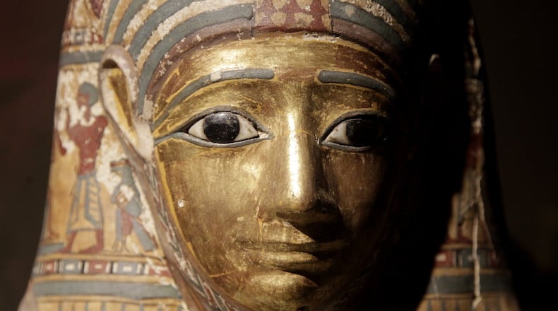 Mummies were provided funerary masks that helped the soul recognize the body in the afterlife. The mask is on display in “Ancient Egypt, a new exhibit at The Boonshoft Museum of Discovery. LISA POWELL / STAFF