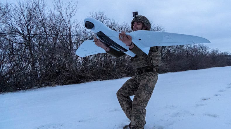 A Ukrainian soldier of the 48th separate brigade launches a reconnaissance drone in Kharkiv region, Ukraine, Wednesday, March 4, 2026. (AP Photo/Andrii Marienko)