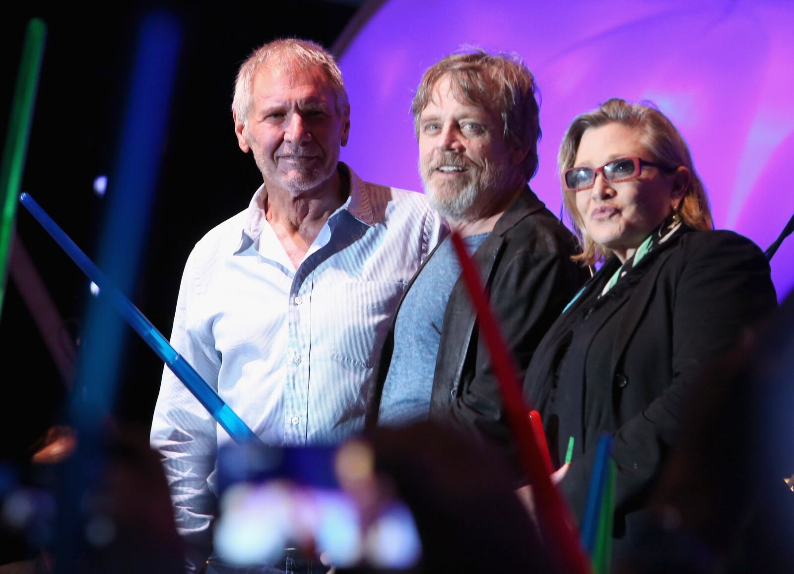 Actors Harrison Ford (from left), Mark Hamill, Carrie Fisher and more than 6,000 fans enjoyed a surprise “Star Wars” Fan Concert performed by the San Diego Symphony, featuring the classic “Star Wars” music of composer John Williams, at the Embarcadero Marina Park South in 2015. (Photo by Jesse Grant/Getty Images for Disney)
