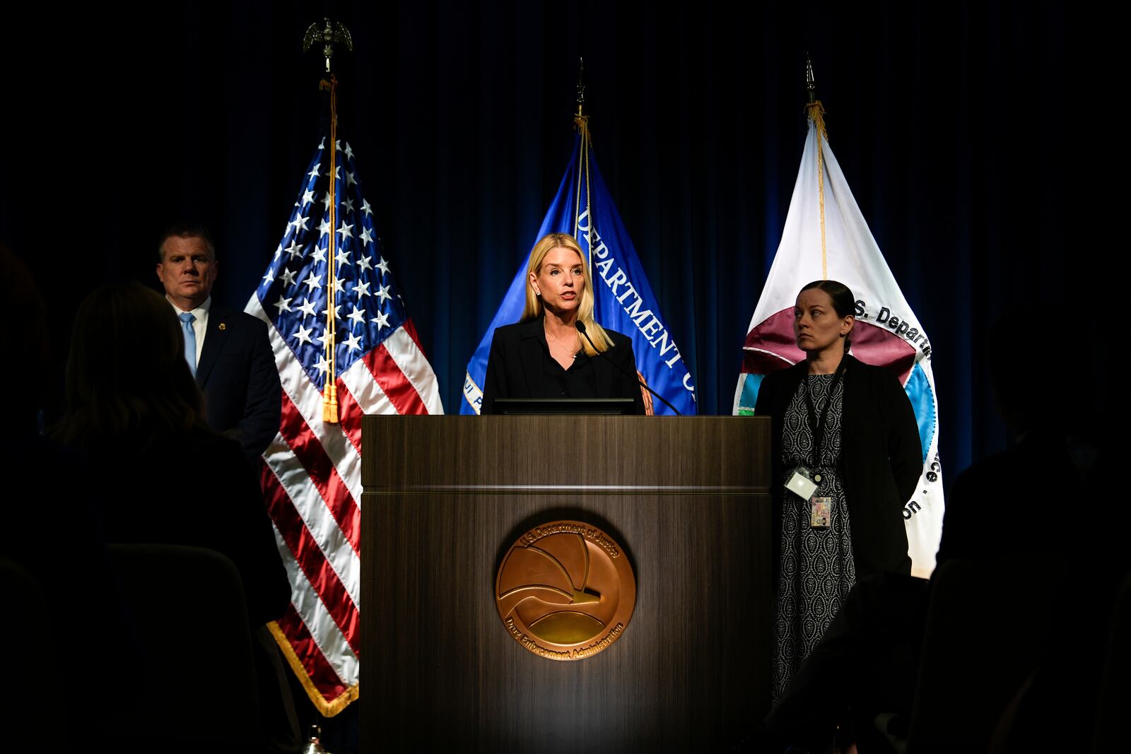 Attorney General Pam Bondi, center, speaks at a news conference at the Drug Enforcement Administration, Tuesday, July 15, 2025, in Arlington, Va. (AP Photo/Julia Demaree Nikhinson)