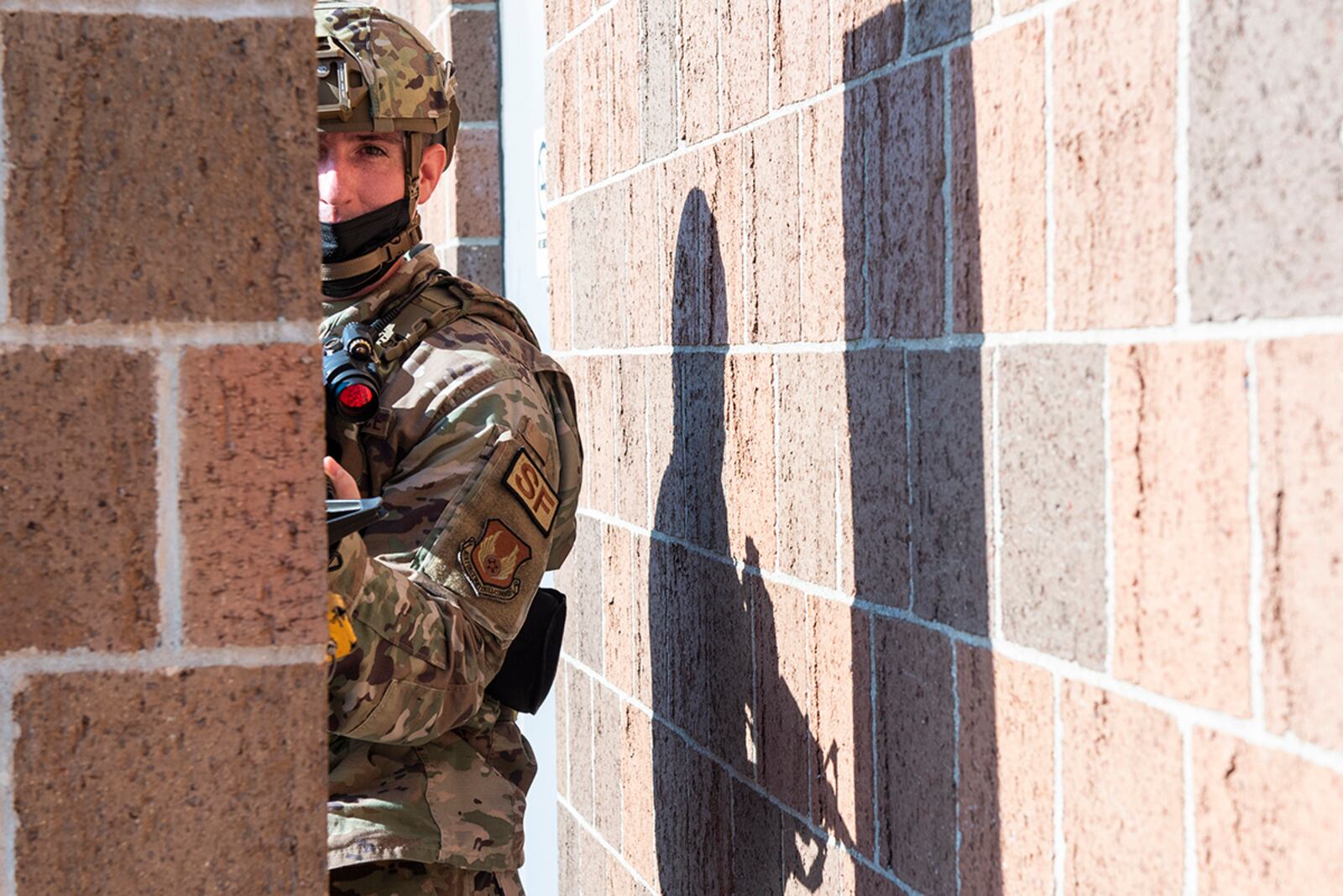 An 88th Security Forces Squadron member secures a building perimeter during an active-shooter exercise Aug. 18 at Wright-Patterson Air Force Base. U.S. AIR FORCE PHOTO/WESLEY FARNSWORTH