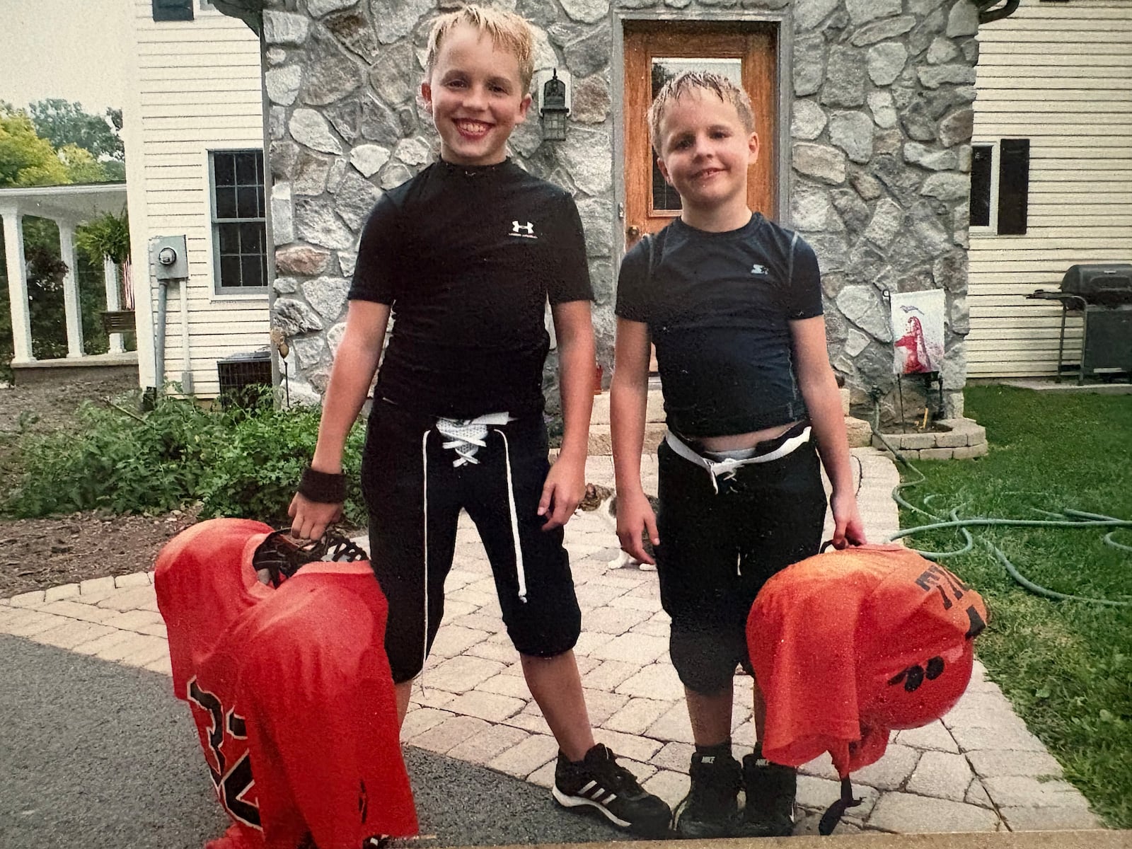 The Moell Brothers – fourth grader Levi (right) and sixth grader Dusty – when they played Pee Wee Football in West Liberty. CONTRIBUTED PHOTO
