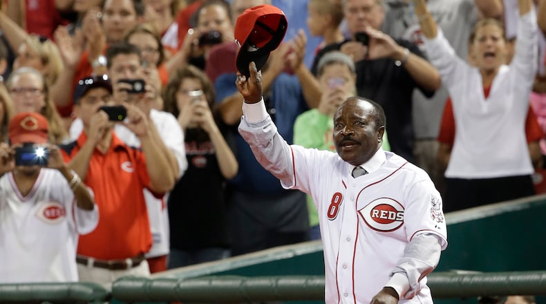 Hall of Fame second baseman Joe Morgan walks onto the field during ceremonies honoring the starting eight of the 1975-76 World Series-champion Cincinnati Reds following a baseball game between the Reds and the Los Angeles Dodgers, Friday, Sept. 6, 2013, in Cincinnati. AL BEHRMAN / ASSOCIATED PRESS