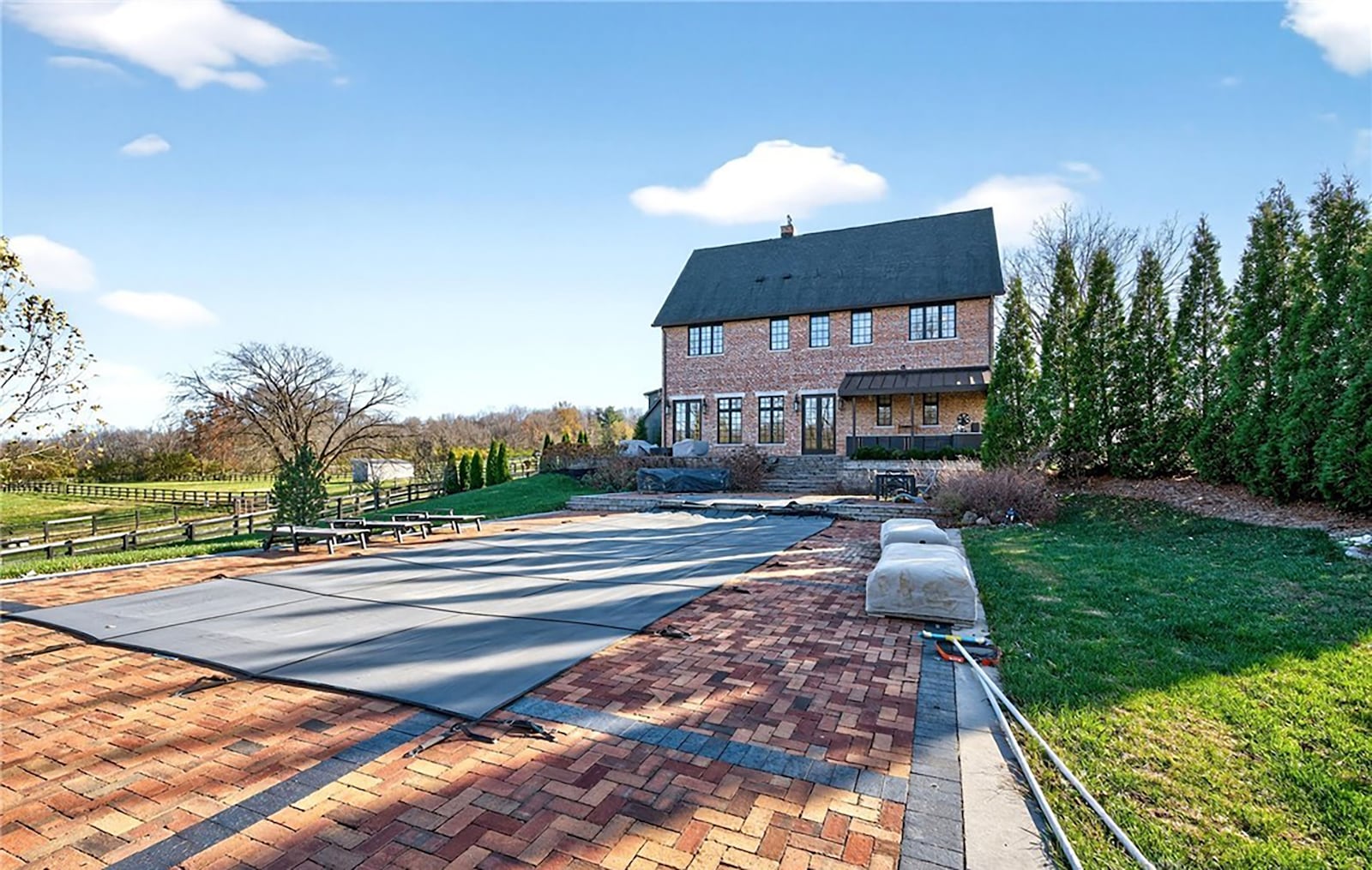 The home features a wraparound brick paver patio, outdoor kitchen and brick paver patio with inground salt water pool. CONTRIBUTED