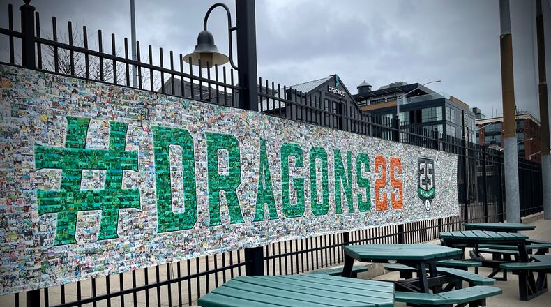 To celebrate the Dayton Dragons' 25th season, the organization asked fans to submit photos of their families over the years to be used in banners throughout the ballpark. NATALIE JONES/STAFF