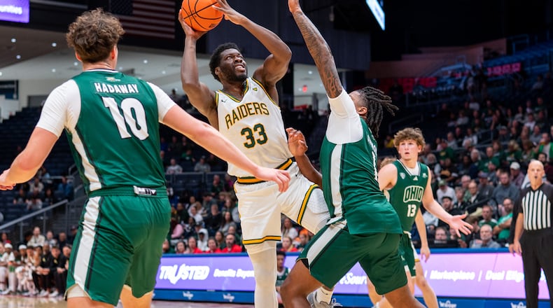 Wright State University forward Michael Imariagbe shoots over an Ohio University defender during their preseason game on Monday, Oct. 20 at UD Arena. The Raiders beat the Bobcats 63-57. WRIGHT STATE ATHLETICS / CONTRIBUTED PHOTO