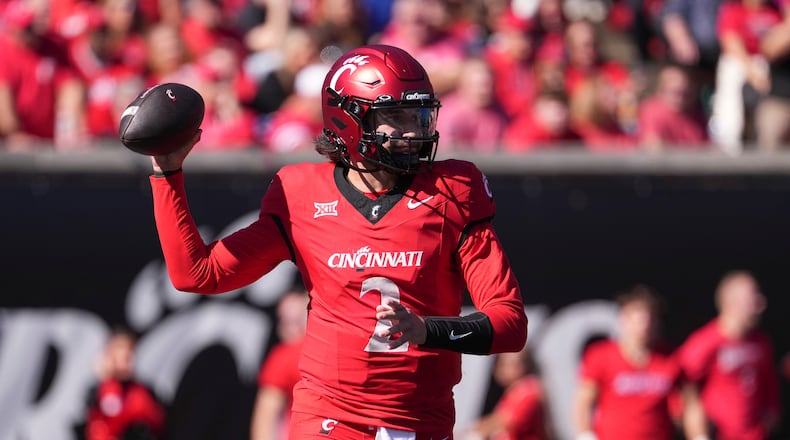Cincinnati's Brendan Sorsby throws during the first half of an NCAA college football game against Arizona State, Saturday, Oct. 19, 2024, in Cincinnati. (AP Photo/Kareem Elgazzar)