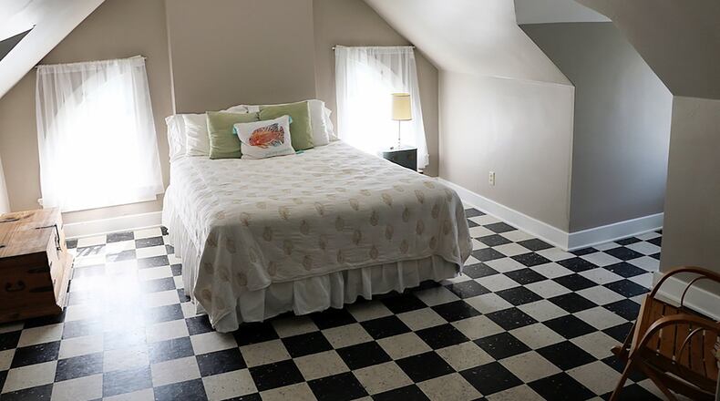 The top floor with a full bath and 2 bedrooms is ideal for guests.