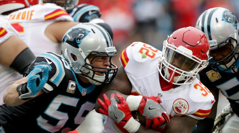 CHARLOTTE, NC - NOVEMBER 13: Luke Kuechly #59 of the Carolina Panthers tackles Spencer Ware #32 of the Kansas City Chiefs in the 1st quarter during their game at Bank of America Stadium on November 13, 2016 in Charlotte, North Carolina. Both Kuechly (St. Xavier) and Ware (Princeton) are from Cincinnati. (Photo by Streeter Lecka/Getty Images)