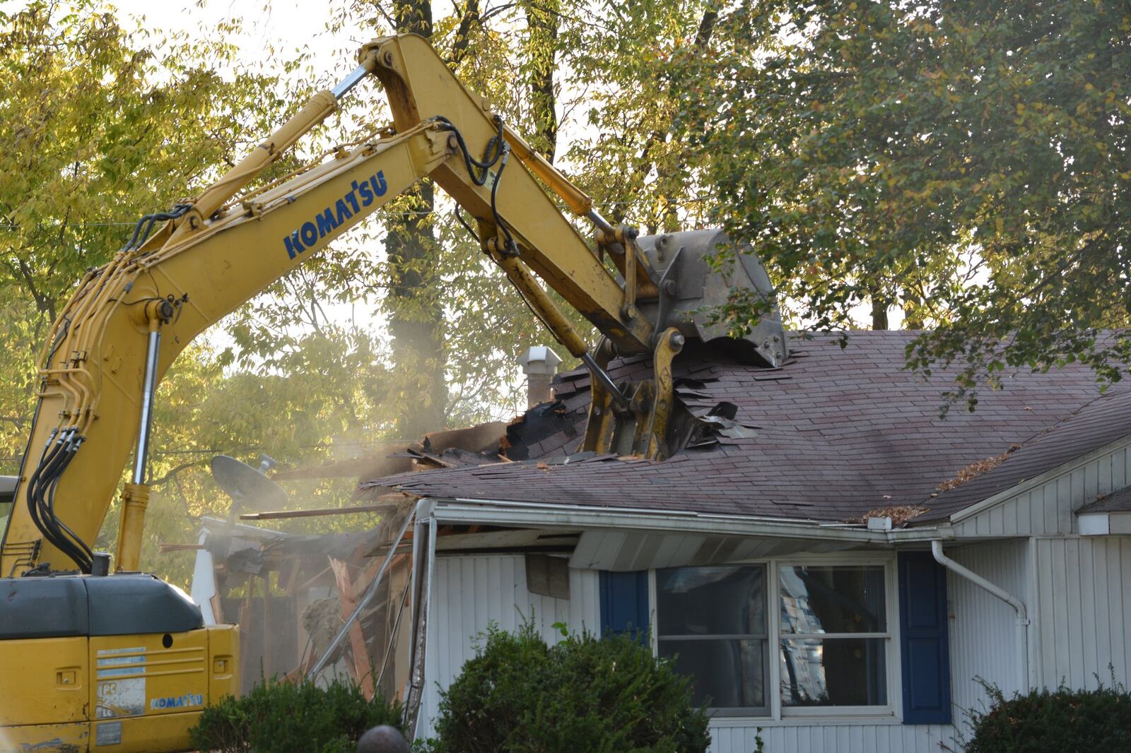 Demolition of the house at 274 Miles Ave., Tipp City Monday did not take long, ending many years of controversy. JIM OTTE/STAFF