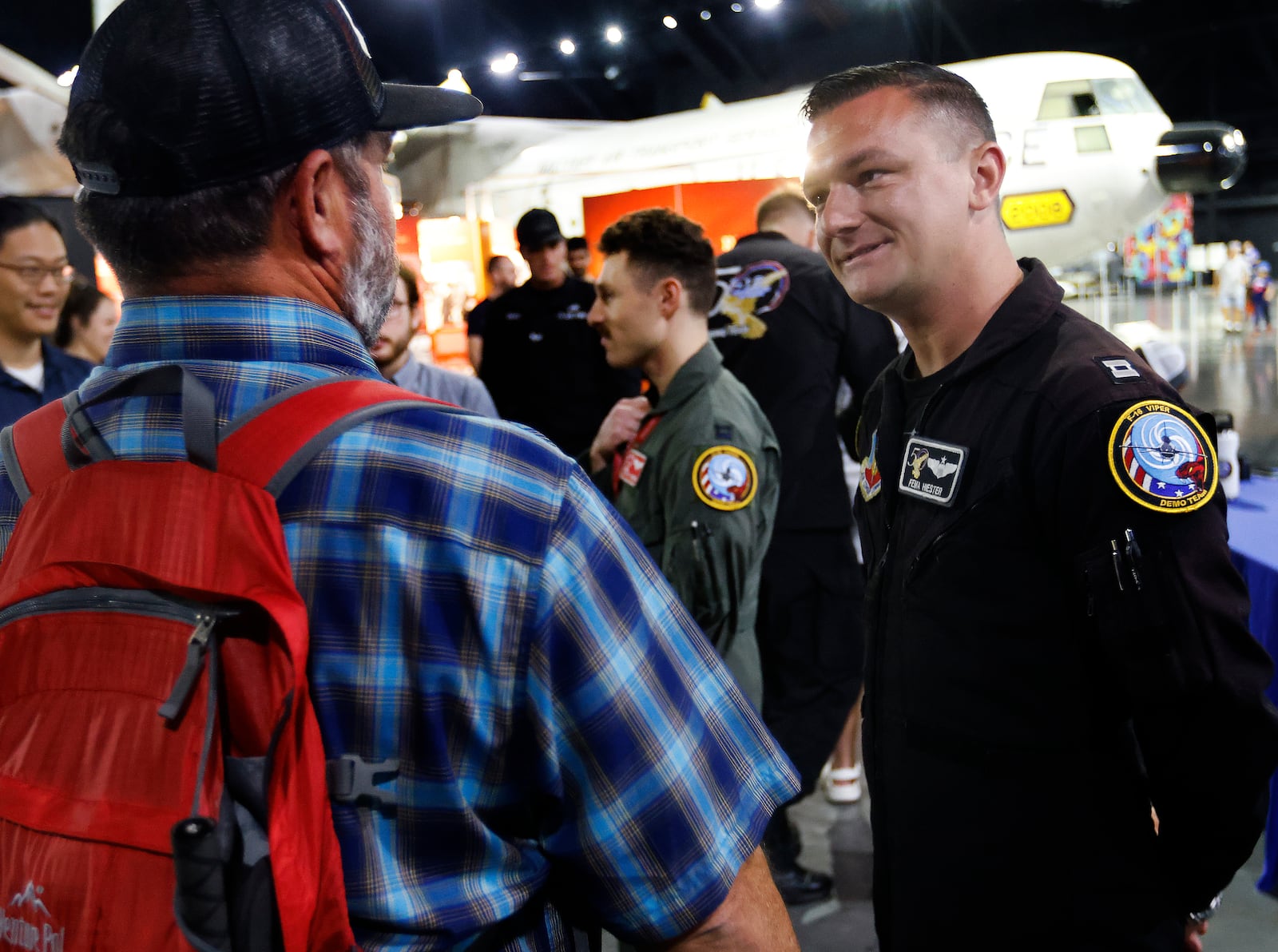 Capt. Taylor “FEMA” Hiester, right, pilot for the F-16 Viper Demonstration Team and crew members talked to visitors Monday, June 24, 2024 at the National Museum of the U.S. Air Force. The team performed at the Dayton Air Show over the weekend to celebrate the 50th anniversary of the F-16 Fighting Falcon. MARSHALL GORBY\STAFF