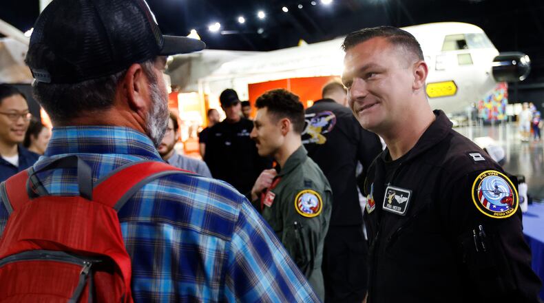 Capt. Taylor “FEMA” Hiester, right, pilot for the F-16 Viper Demonstration Team and crew members talked to visitors Monday, June 24, 2024 at the National Museum of the U.S. Air Force. The team performed at the Dayton Air Show over the weekend to celebrate the 50th anniversary of the F-16 Fighting Falcon. MARSHALL GORBY\STAFF