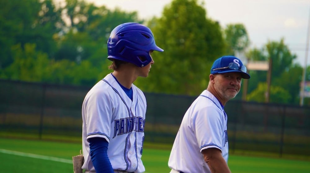 Springboro coach Mark Pelfrey gets done chatting with Colten Muhlenkamp before he heads to the plate during a Division I state semifinal against Perrysburg on Saturday at Thurman Munson Memorial Stadium in Canton. CHRIS VOGT / CONTRIBUTED