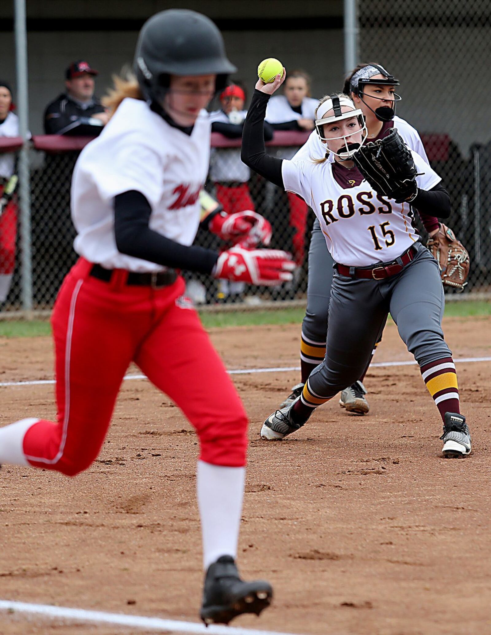 Ross third baseman Whitley Arno throws to first after a sacrifice bunt by Madison’s Ally King on Saturday at Ross. CONTRIBUTED PHOTO BY E.L. HUBBARD