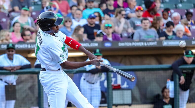 Dayton Dragons outfielder Mariel Bautista hits a home run in the first inning of their game against the Clinton LumberKings on Monday, May 6 at Fifth Third Field. The Dragons won 5-4. MICHAEL COOPER / CONTRIBUTED