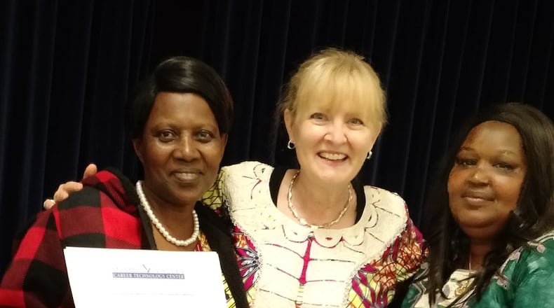Rebecca Williams (pictured center) stands with ESOL students Alivera Mukamurengera (left) and Kabibi Ruseka. Both students are from Rwanda. CONTRIBUTED