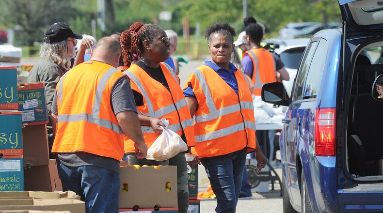 The Foodbank Inc. held a drive-thru food distribution at the old Salem Mall in Trotwood Thursday Sept. 15, 2022. Guests received fresh produce, proteins, grains and other products free of charge. MARSHALL GORBY\STAFF
MARSHALL GORBY\STAFF