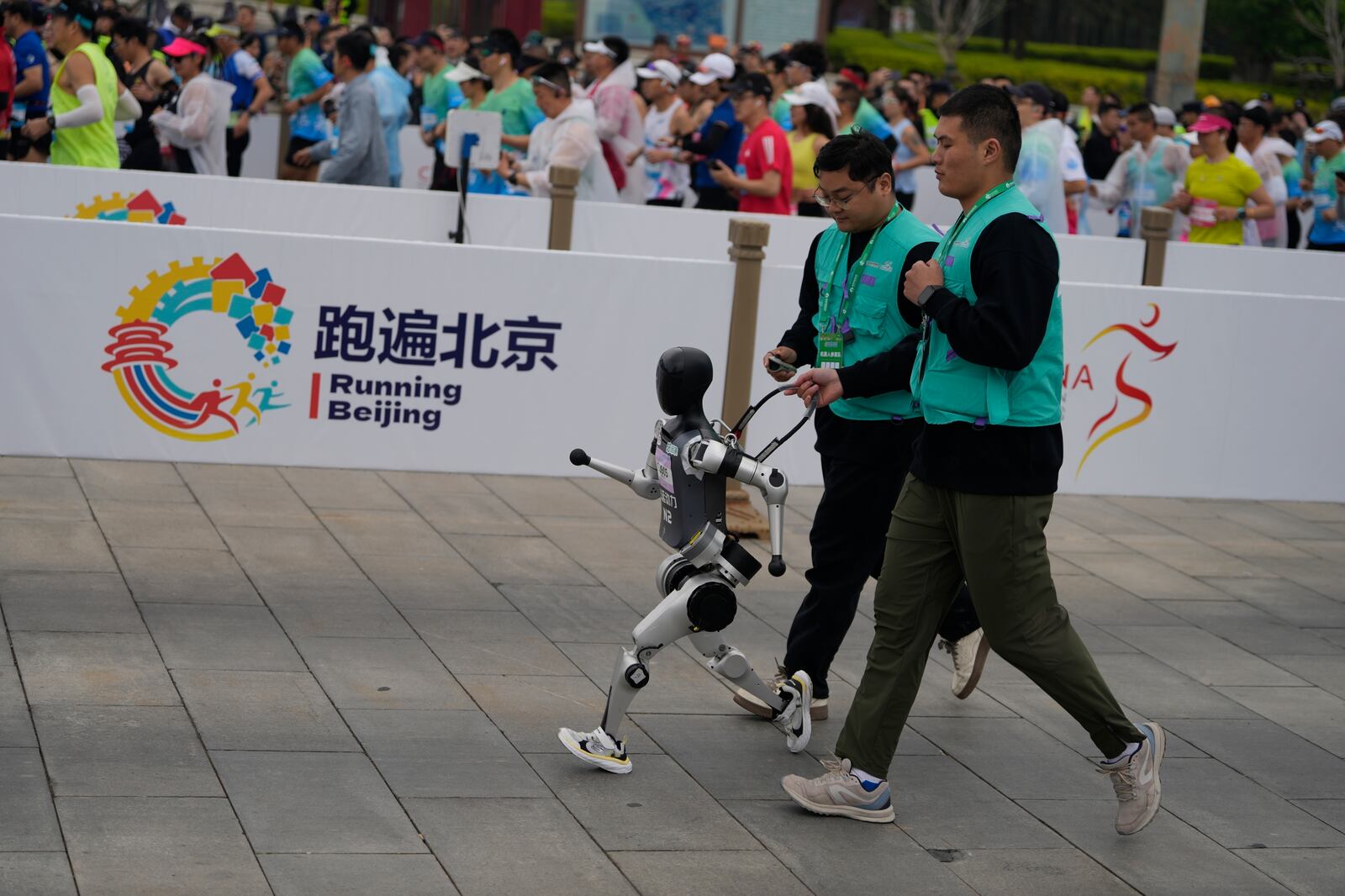 A robot takes part in what is billed as the world's first robot half marathon during the Humanoid Robot Half-Marathon held in Beijing on Saturday, April 19, 2025. (AP Photo/Ng Han Guan)