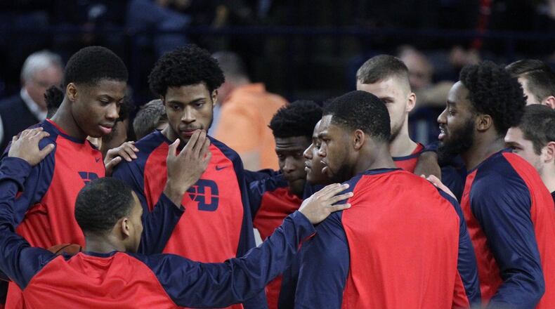 Dayton players huddle before a game against Richmond on Tuesday, Jan. 9, 2018, at the Robins Center in Richmond, Va. David Jablonski/Staff