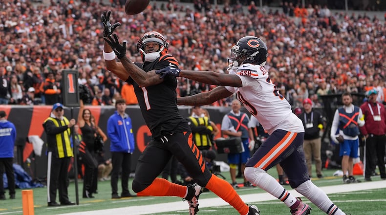 Cincinnati Bengals wide receiver Ja'Marr Chase (1) tries to catch a pass under pressure from Chicago Bears cornerback Tyrique Stevenson (29) during the first half of an NFL football game, Sunday, Nov. 2, 2025, in Cincinnati. (AP Photo/Joshua A. Bickel)