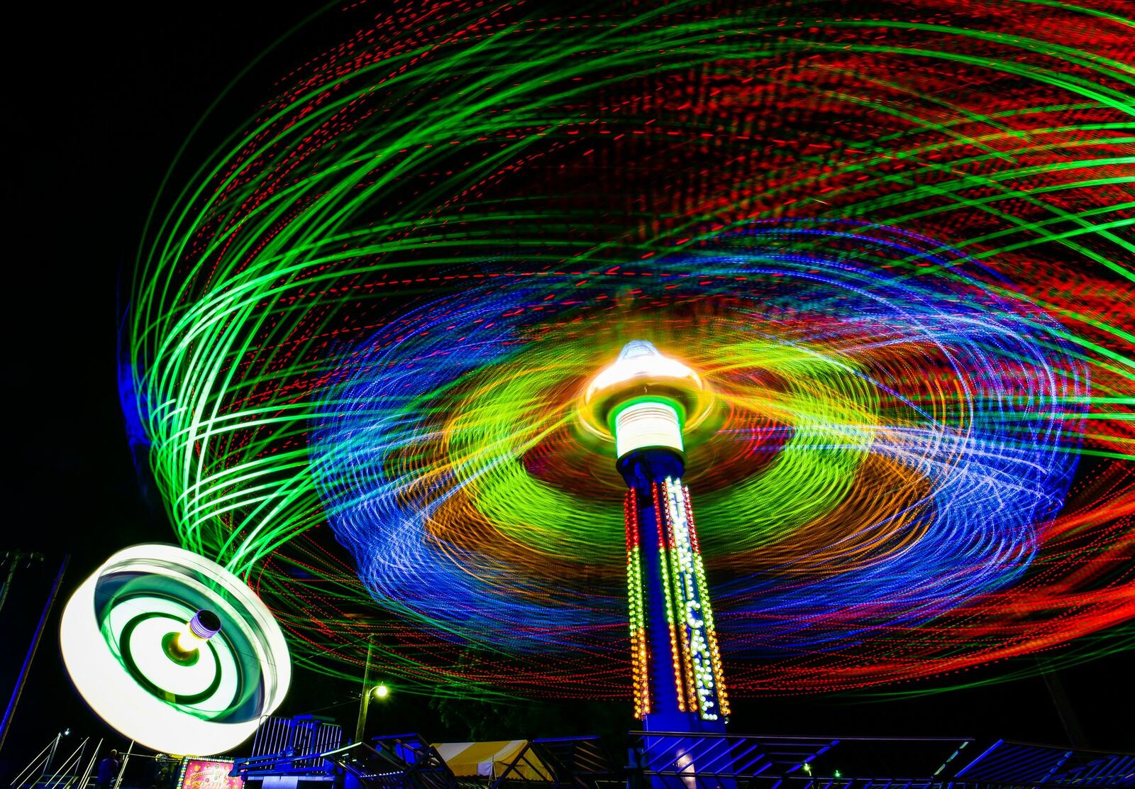 The Hurricane ride spins during the Butler County Fair in Hamilton. NICK GRAHAM/STAFF
