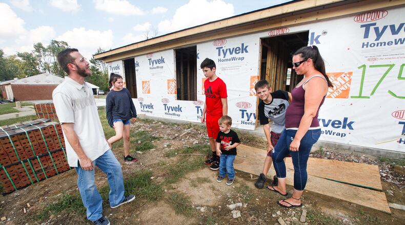 Gloria and Kevin Pennington spent harrowing minutes with their children Noah, 13, 10-year-old twins, Ayden and Alyson, and Owen, 2, as the EF4 Memorial Day tornado took apart their Brookville home. They are among survivors rebuilding in Terrace Park. CHRIS STEWART / STAFF