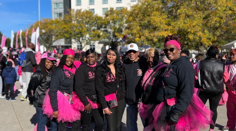 A group of Dayton women pose with Dayton Mayor Jeffery Mims Jr. before they participate Saturday in the Making Strides Breast Cancer Awareness Walk in downtown Dayton. Contributed