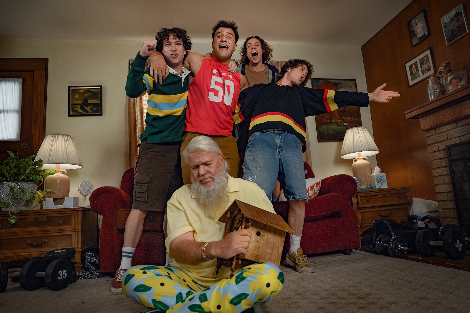 This image released by Netflix shows, background from left, Philip Schneider as Bobby, Maxwell Friedman as Gordie, Ethan Cutkosky as Wayne, Conor Sherry as Terry and John Daly as John Daly in "Happy Gilmore 2." (Scott Yamano/Netflix via AP)