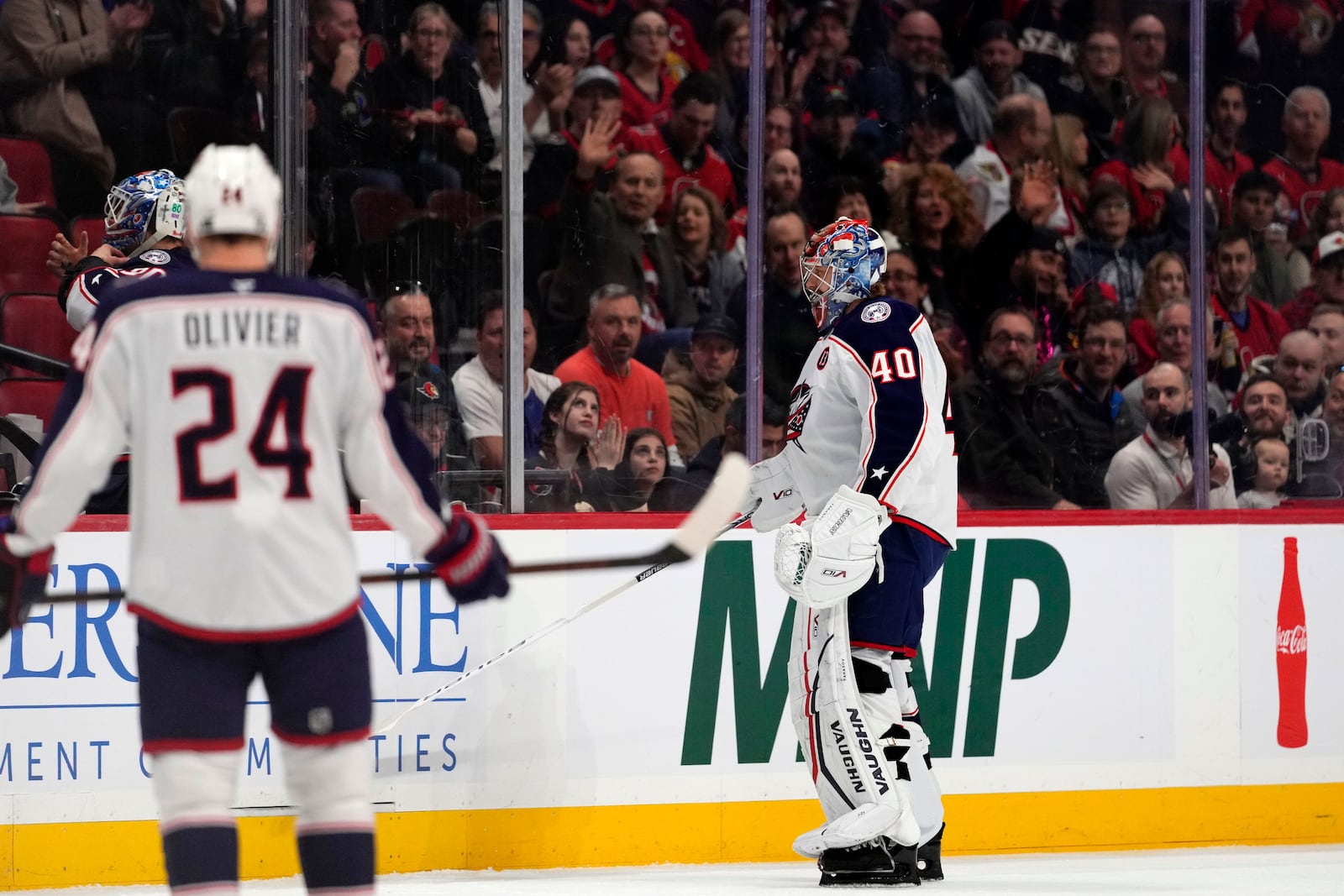 Columbus Blue Jackets goaltender Daniil Tarasov (40) leaves the ice after getting scored against twice by the Ottawa Senators during first-period NHL hockey game action in Ottawa, Ontario, Sunday, April 6, 2025. (Justin Tang/The Canadian Press via AP)
