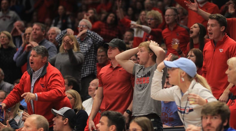 Dayton fans protest a call during a game against Virginia Tech on Sunday, Dec. 12, 2021, at UD Arena. David Jablonski/Staff