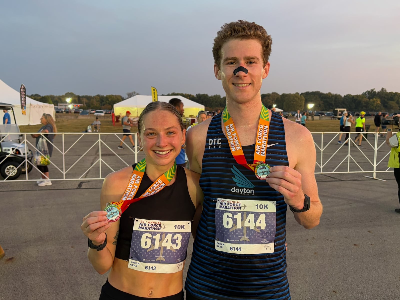 Mackenna Curtis -Collins and Casey Faulkner - who were recently engaged to be married - each won their division at the Air Force Marathon on Saturday morning at Wright Patterson Air Force Base. TOM ARCHDEACON / CONTRIBUTED PHOTO