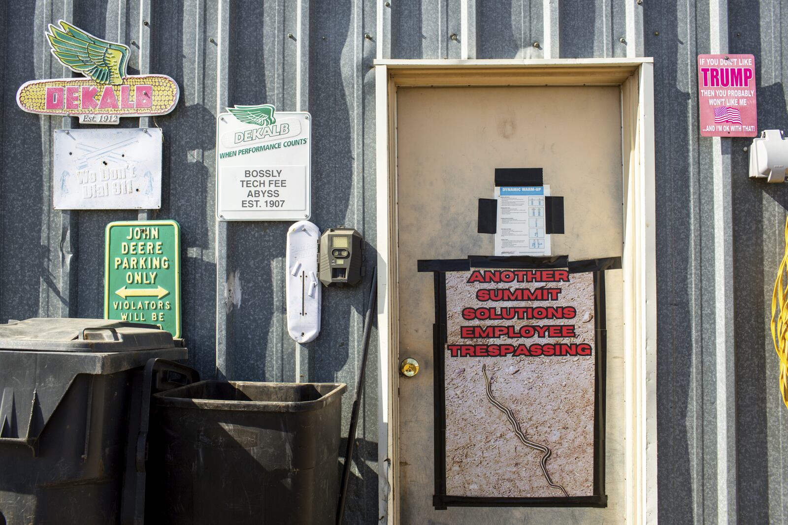 A sign depicting a snake with the caption "Another Summit Solutions Employee Trespassing" hangs on Jared Bossly's garage on his ranch in Mansfield, S.D., on Tuesday, March 11, 2025. (AP Photo/Nicole Neri)