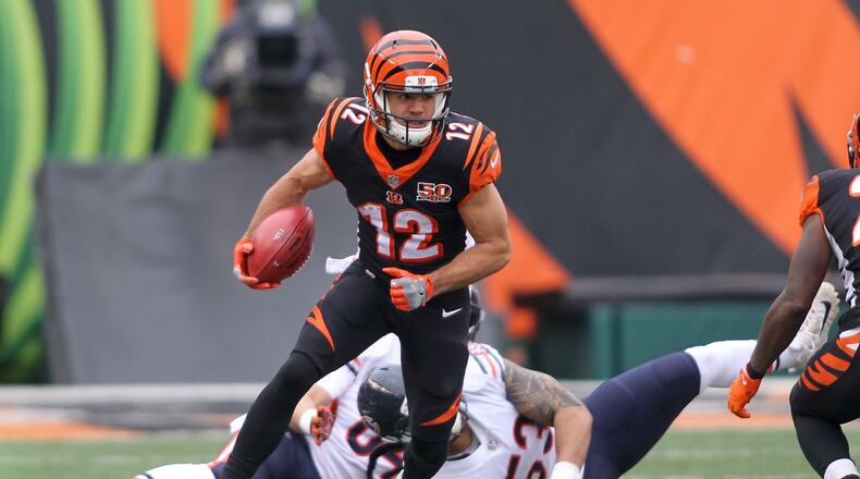 CINCINNATI, OH - DECEMBER 10: Alex Erickson #12 of the Cincinnati Bengals runs with the ball against the Chicago Bears during the first half at Paul Brown Stadium on December 10, 2017 in Cincinnati, Ohio. (Photo by John Grieshop/Getty Images)
